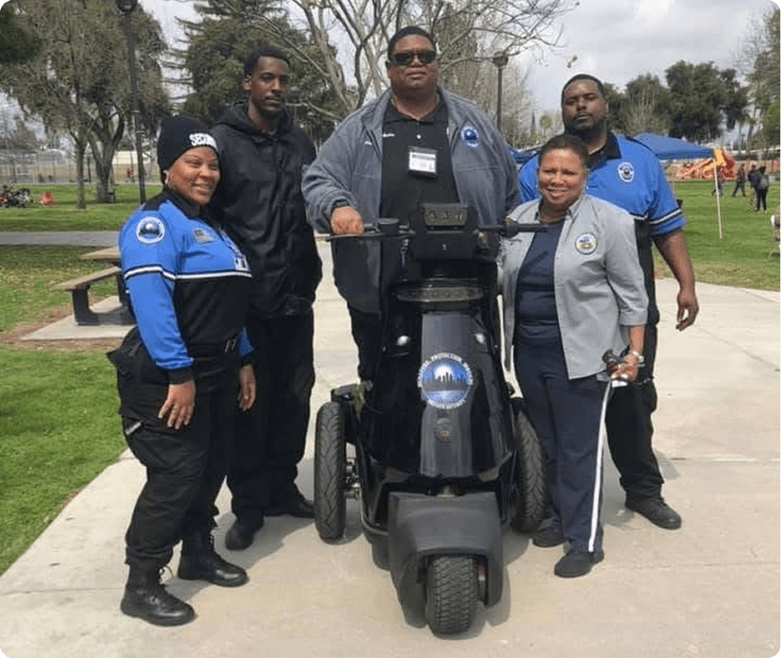 Group of officers with mobility scooter